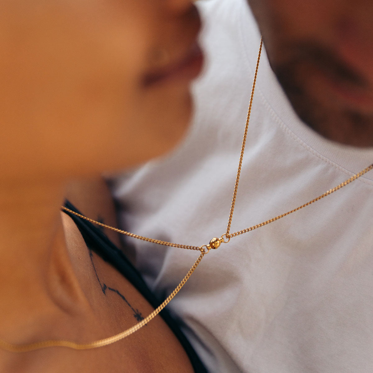 Magnetic chain necklaces in gold connected