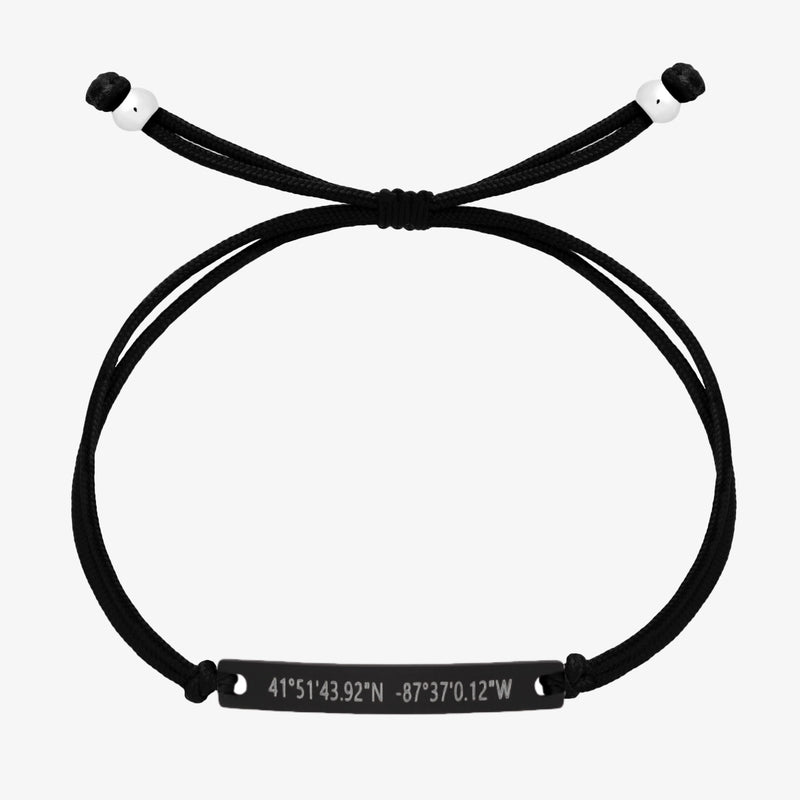 Black thread bracelet with coordinates engraved on a black bar