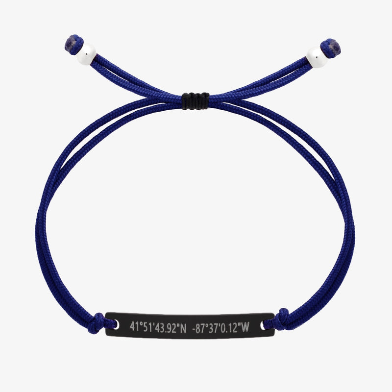 Navy blue thread bracelet with a black bar and engraved coordinates