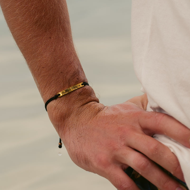 Black thread bracelet with gold bar