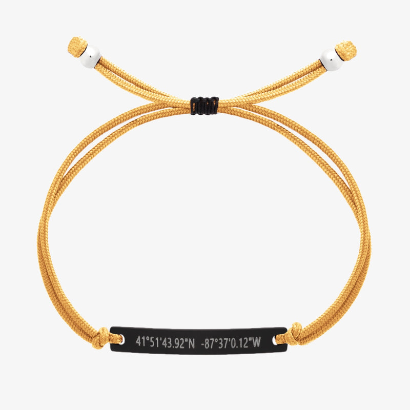 Yellow thread bracelet with a black bar and engraved coordinates